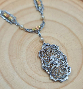 10k white and rose gold art deco inspired piece with pearls