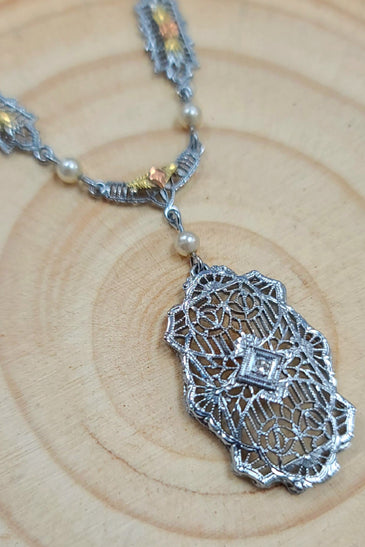 10k white and rose gold art deco inspired piece with pearls