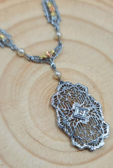 Art Deco pearl pendant necklace with ornate filigree teardrop pendant and chain