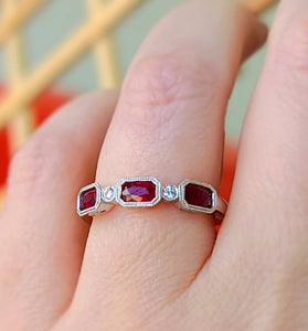stunning band featuring 14k white gold and emerald cut ruby and diamond