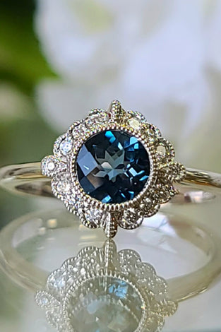 14k white gold ring featuring a round london blue topaz