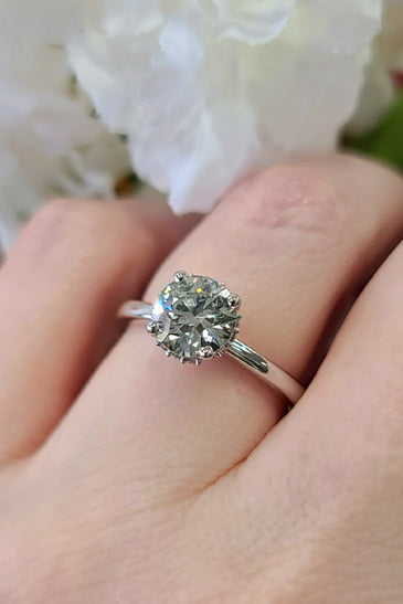 elegant 14k white gold ring with a 159cttw lab grown diamond surrounded by a halo design
