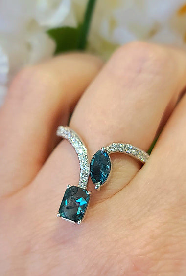 White gold fashion ring with blue square diamonds and pavé accents