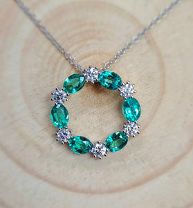 14k yellow gold creates a stunning pendent with emerald and diamond