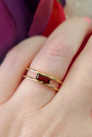 14kt yellow gold east-west garnet ring with rectangular red gemstone