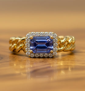 14kt yellow gold ring with blue sapphire and diamond halo, twisted band