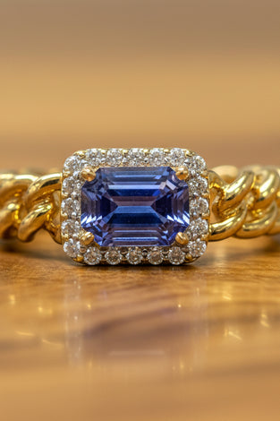 14kt yellow gold ring with blue sapphire and diamond halo, twisted band
