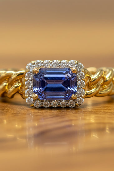 14kt yellow gold ring with blue sapphire and diamond halo, twisted band