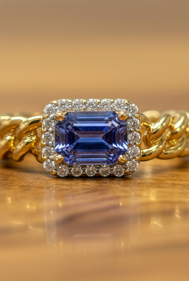14kt yellow gold ring with blue sapphire and diamond halo, twisted band