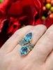 Sterling silver and yellow gold ring with two blue topaz teardrop gemstones