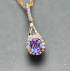 Yellow gold alexandrite diamond pendant with oval stone and diamond halo