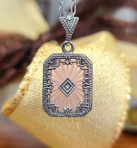 art deco pendent made with sterling silver with a pink glass center