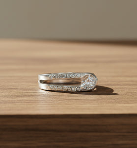 Sterling silver ring with pavé stones and round white topaz center