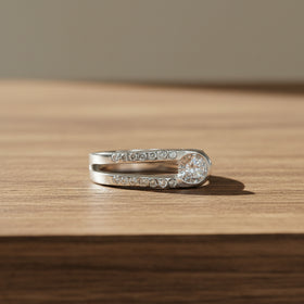 Sterling silver ring with pavé stones and round white topaz center