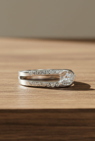 Sterling silver ring with pavé stones and round white topaz center