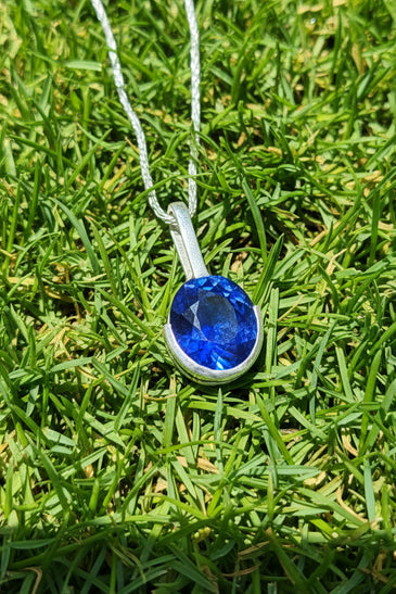 Sterling Silver Lab Blue Sapphire Half Bezel Pendant