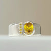 Sterling silver CZ ring with large yellow bezel-set center stone and side accents