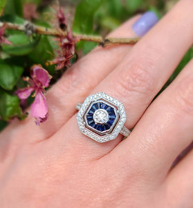 stunning blue sapphires and diamonds create a mesmerizing design on a 14k white gold band