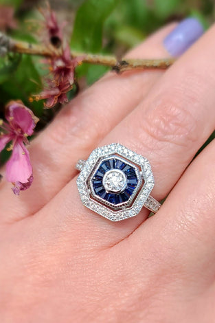 stunning blue sapphires and diamonds create a mesmerizing design on a 14k white gold band
