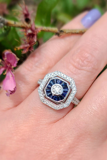 stunning blue sapphires and diamonds create a mesmerizing design on a 14k white gold band