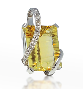 Citrine pendant in white gold with diamond pave accents and prong-set yellow center