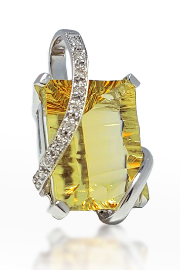 Citrine pendant in white gold with diamond pave accents and prong-set yellow center
