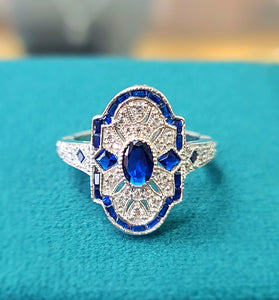 stunning deco ring with blue and white CZ stones and sterling silver
