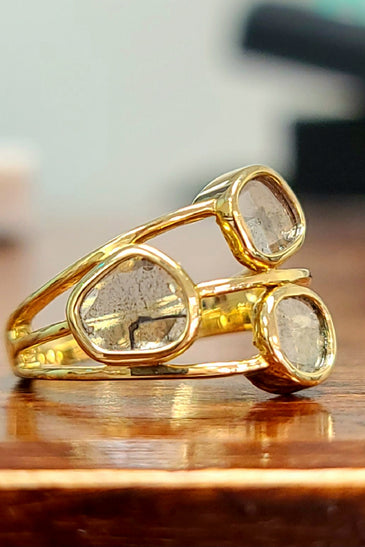 unique free form salt + pepper diamonds encased in a 14k yellow gold bezel