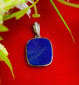 Lapis lazuli square pendant in sterling silver with small bezel-set side stones