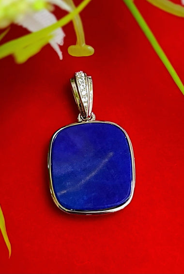 Lapis lazuli square pendant in sterling silver with small bezel-set side stones
