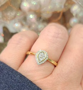 pear shaped diamond on a 14k yellow gold band