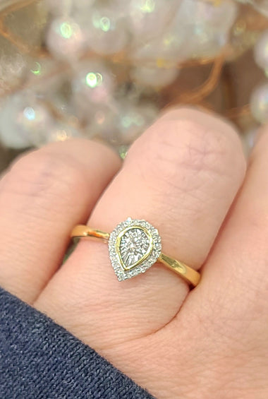 14kt yellow gold pear illusion ring with diamond-like pear halo on band