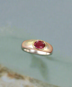 Silver bezel ring with oval pink tourmaline, yellow-gold tone band