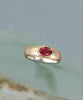 Silver bezel ring with oval pink tourmaline, yellow-gold tone band