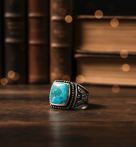 Turquoise-set sterling silver men’s ring, square bezel with patterned shank