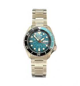 Stainless steel wristwatch with blue dial and rotating bezel, metal link bracelet