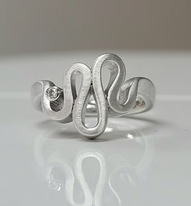 unique fashion ring made with sterling silver and diamonds