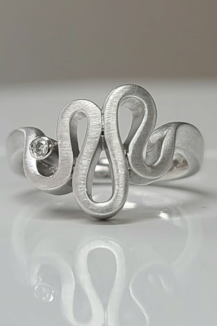 unique fashion ring made with sterling silver and diamonds