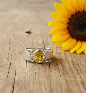 Sterling silver ring with round yellow CZ in bezel setting