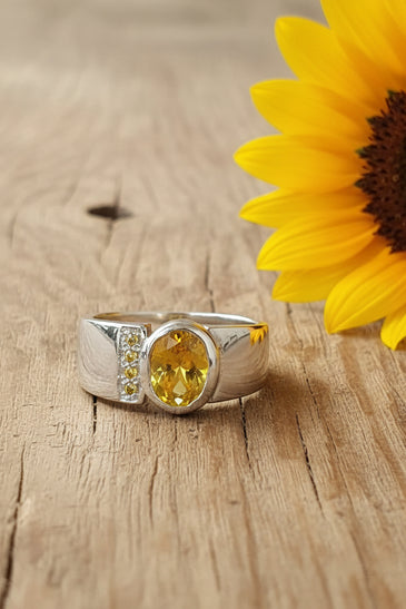 Sterling silver ring with round yellow CZ in bezel setting