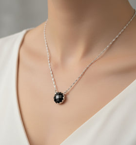 Sterling silver pendant with round black onyx stone on a silver chain