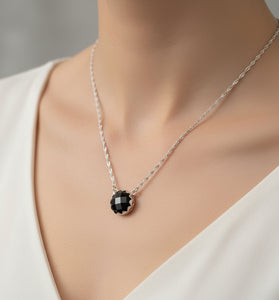 Sterling silver pendant with round black onyx stone on a silver chain