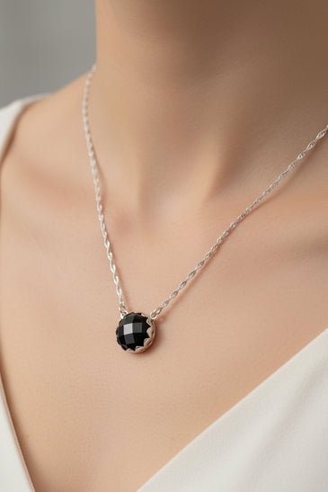 Sterling silver pendant with round black onyx stone on a silver chain
