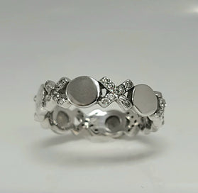Sterling silver CZ ring with domed round centers and clustered small crystal stones