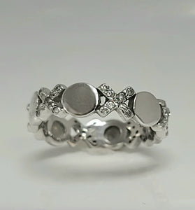 Sterling silver CZ ring with domed round centers and clustered small crystal stones