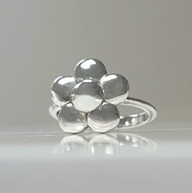 Sterling silver flower ring with polished rounded petals on a slim band