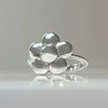 Sterling silver flower ring with polished rounded petals on a slim band