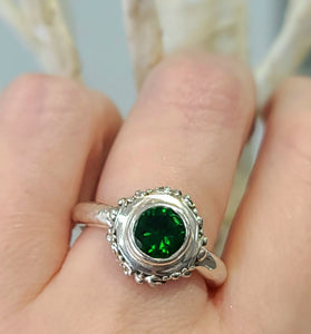 sterling silver ring with a round green quartz bezel