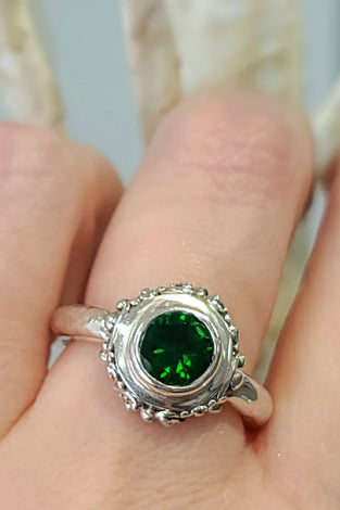 sterling silver ring with a round green quartz bezel