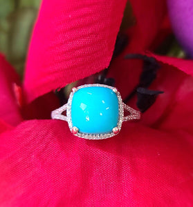 sleeping beauty turquoise surrounded by diamonds and sterling silver